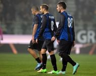 Inter's players Walter Samuel Rodrigo Palacio (C) and Marko Livaja (R) leave the pitch at the end of the match